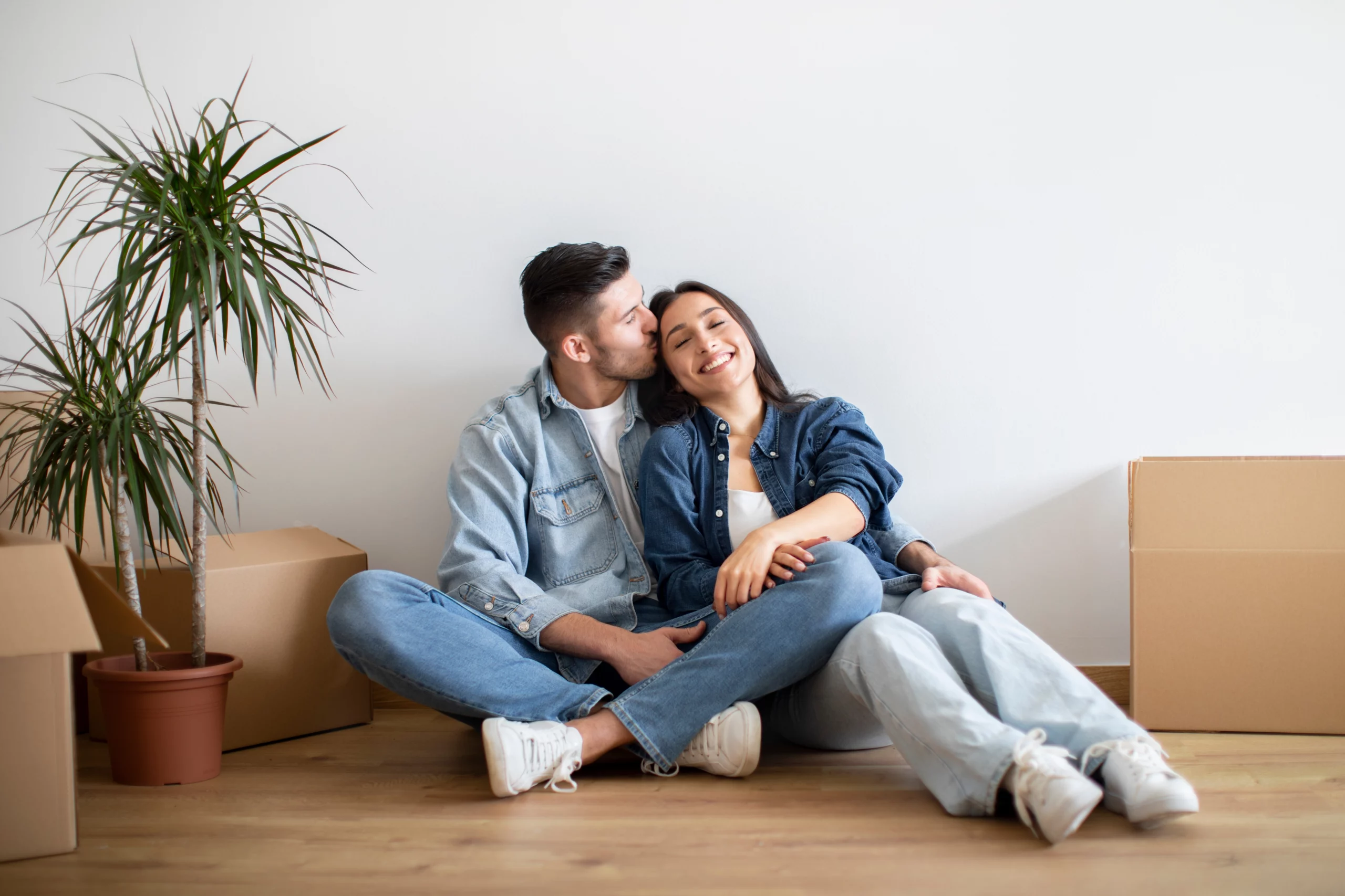 home loan; couple sitting in new home | Oceania Finance