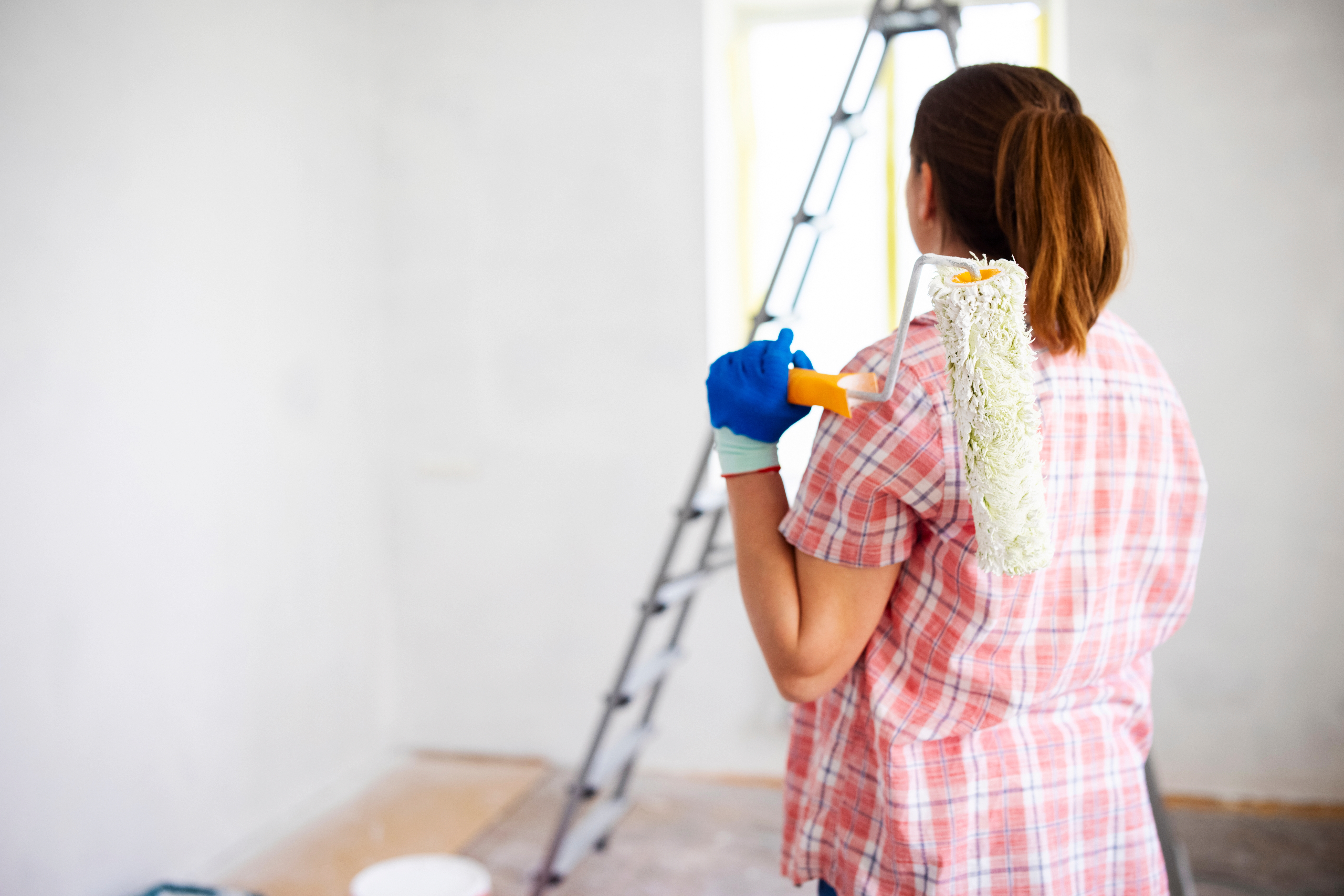 woman plans wall painting; can i get a renovation loan | Oceania Finance