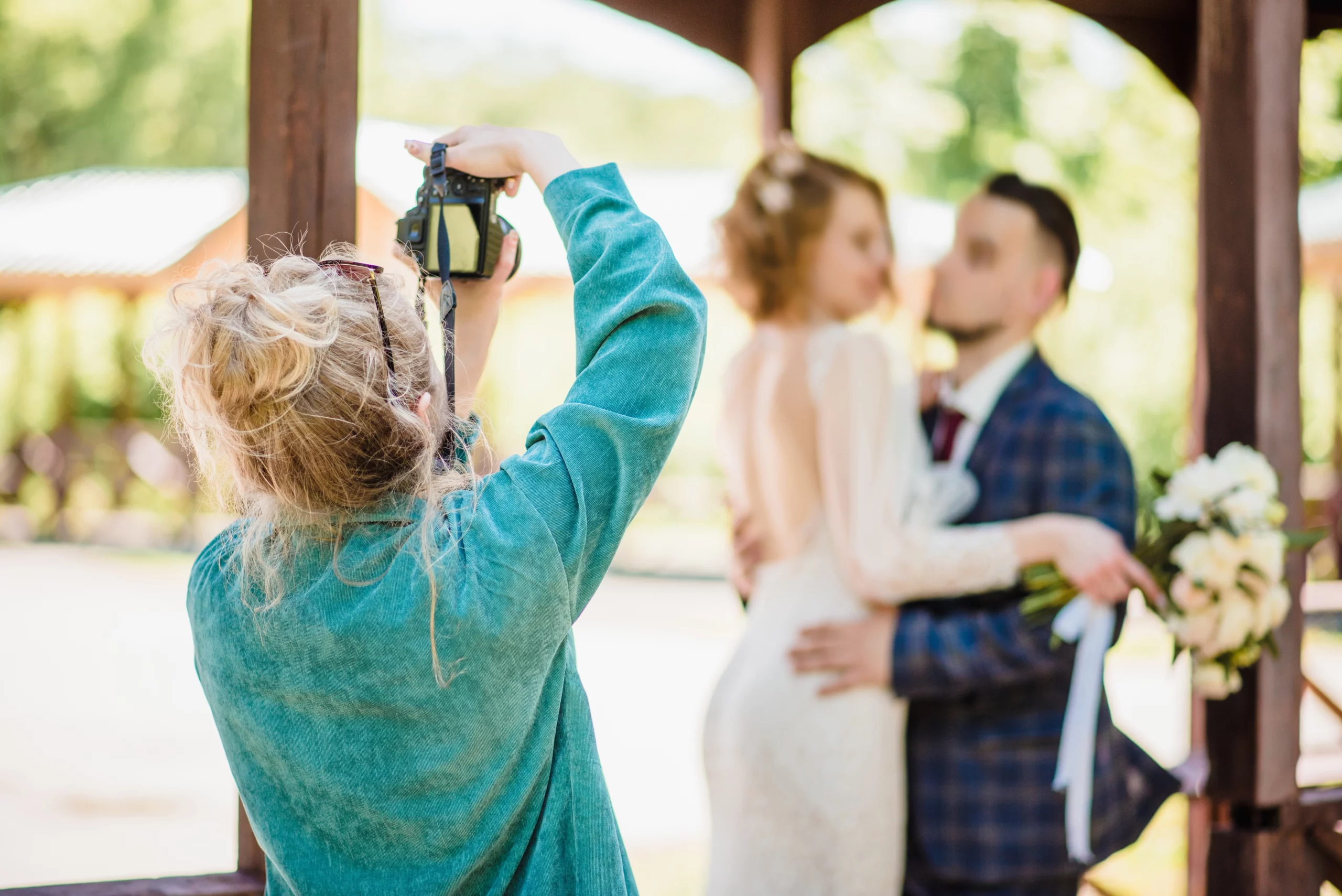 Alt text: what is a wedding loan; photographer at wedding | Oceania Finance
