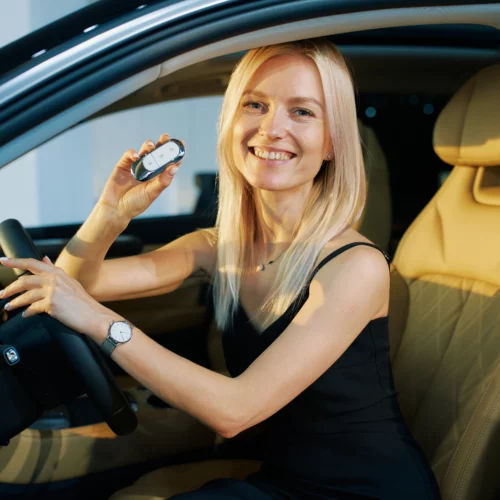 Car Loan Broker Brisbane; lady in car holding keys | Oceania Finance